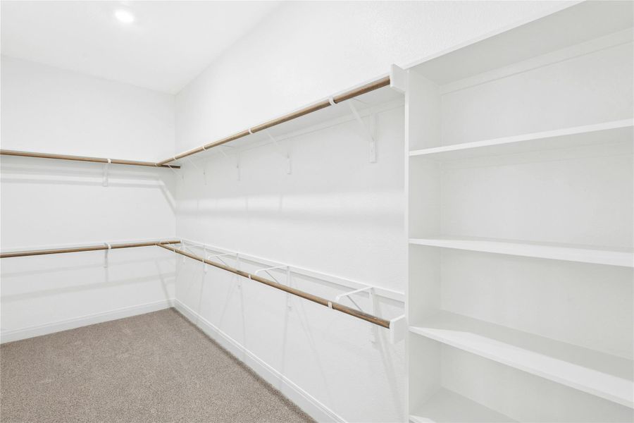 Spacious primary closet Spacious primary closet