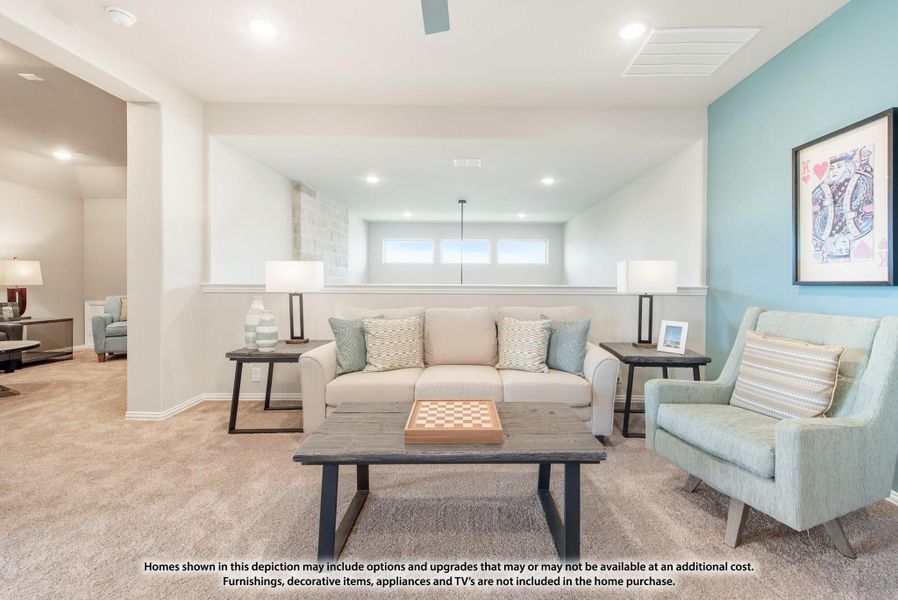 Finished basement living area with beige carpet, teal accent wall, sofa, armchair, and coffee table with chess board Finished basement living area with beige carpet, teal accent wall, sofa, armchair, and coffee table with chess board
