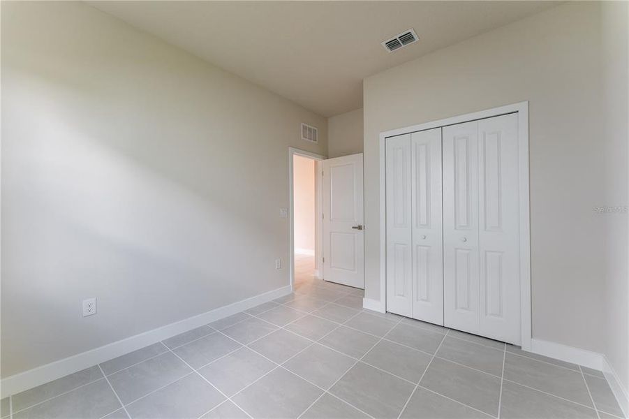 Spacious, unfurnished interior of a new home in The Palms at Venetian Bay, New Smyrna Beach (Image 19).