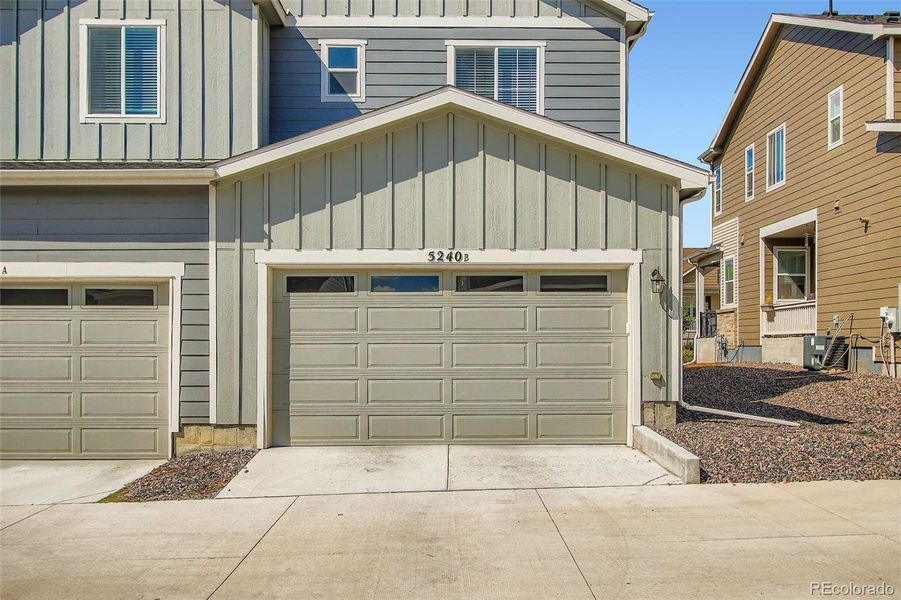 Front exterior of a new home in Haskins Station, Arvada, CO, highlighting curb appeal (Image 26).