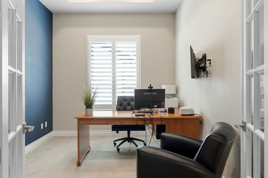 A study with french doors creates a private and functional work-from-home space. A study with french doors creates a private and functional work-from-home space.