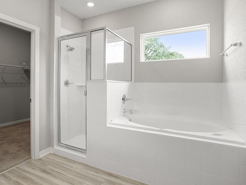 Enjoy spa-like relaxation with a tiled shower and garden tub - Willow II by Highland Homes