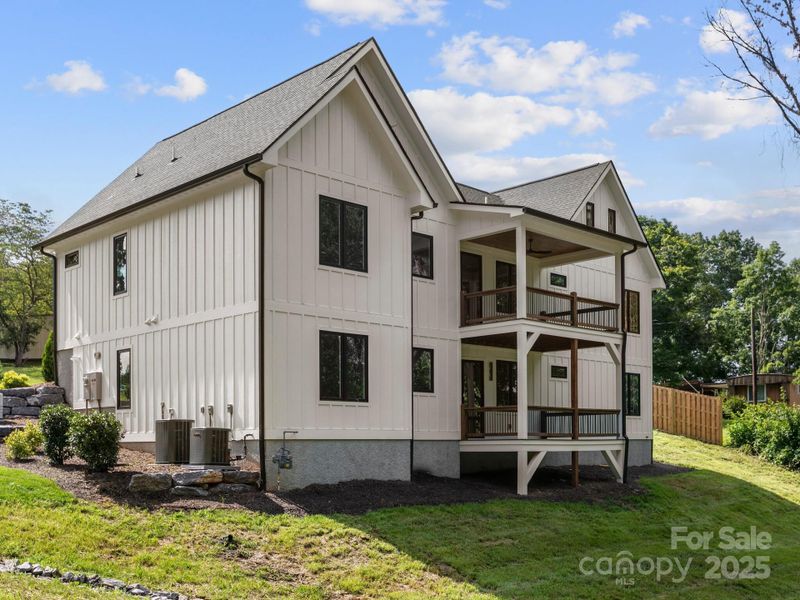 Front exterior of a new home in , Candler, NC, highlighting curb appeal (Image 2).