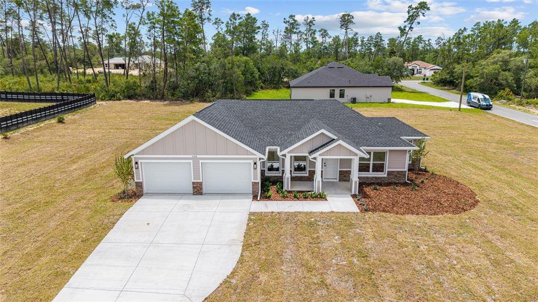 Front exterior of a new home in , Dunnellon, FL, highlighting curb appeal (Image 26). Front exterior of a new home in , Dunnellon, FL, highlighting curb appeal (Image 26).