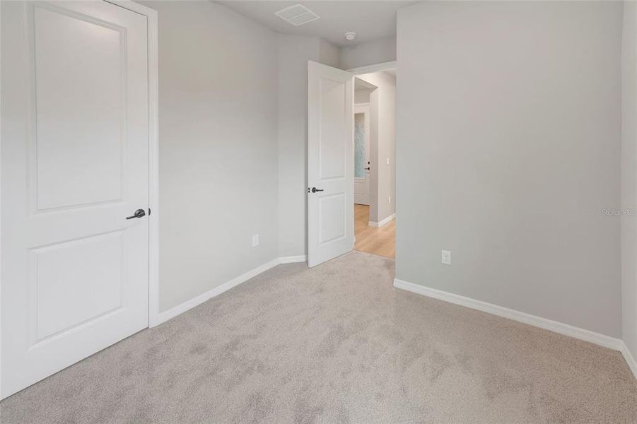 Spacious, unfurnished interior of a new home in Waterset Tradition Series, Apollo Beach (Image 10).