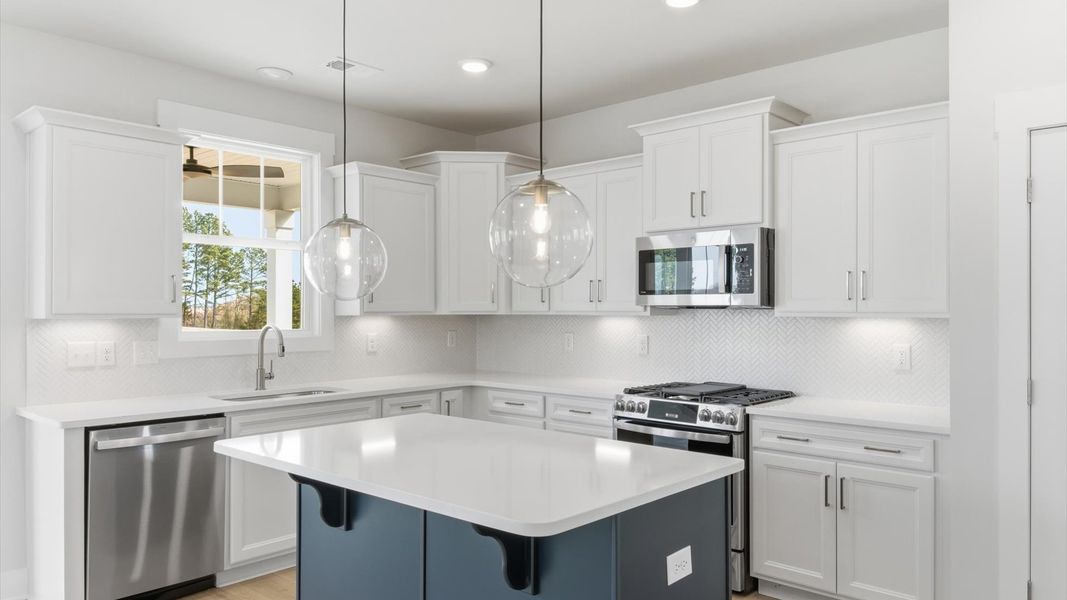 Well-designed kitchen with a center island and tasteful finishes that elevate everyday living located in Gray Court, SC