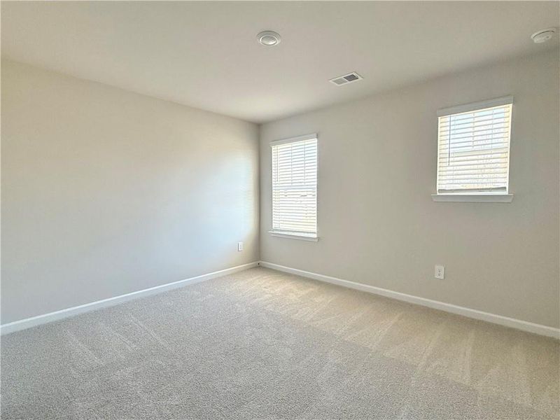Spacious, unfurnished interior of a new home in Vines at Mill Creek - Estate Series, Braselton (Image 21).