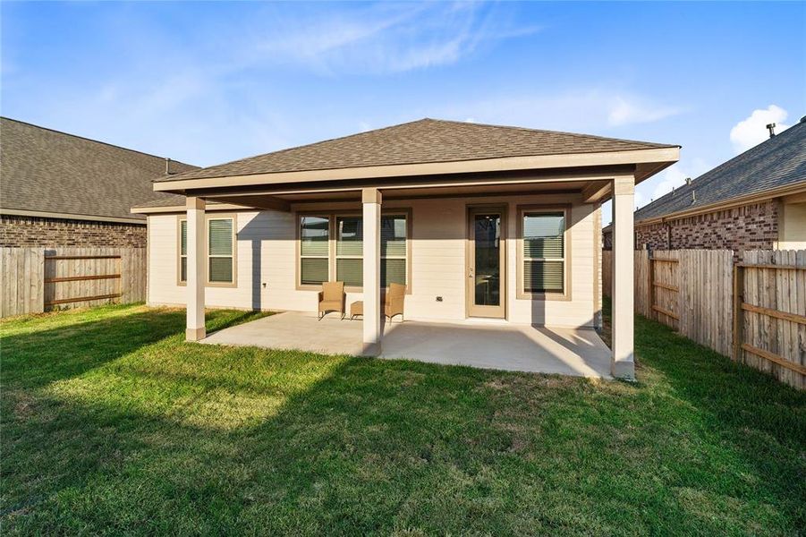 Come and see this spacious backyard with its beautiful covered patio. There is plenty of room for the kids to play and adults to relax!