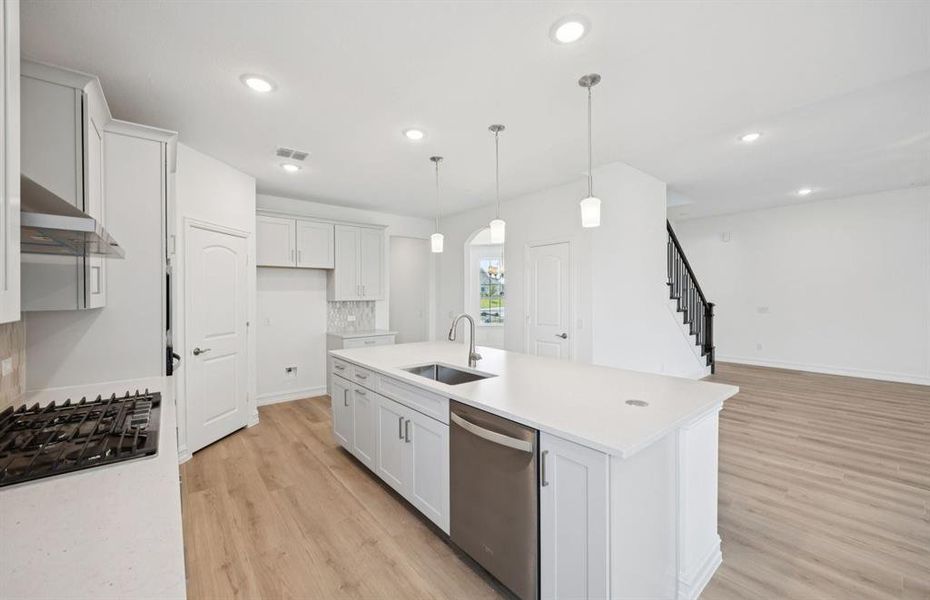 Large island overlooking gathering room and dining areas Large island overlooking gathering room and dining areas