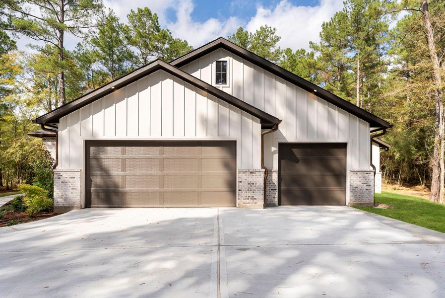Front exterior of a new home in , New Waverly, TX, highlighting curb appeal (Image 2). Front exterior of a new home in , New Waverly, TX, highlighting curb appeal (Image 2).