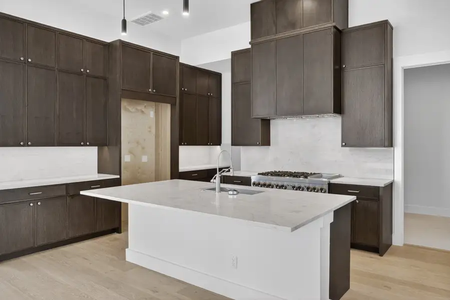 Furnished interior view inside a new home in Milky Way at River Place, Austin (Image 7).