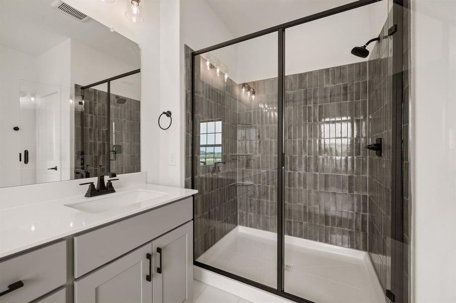 Vanity space for 2 and a spacious walk in shower are only a few of the thoughtful design elements you will find in this beautiful Owner's Suite.