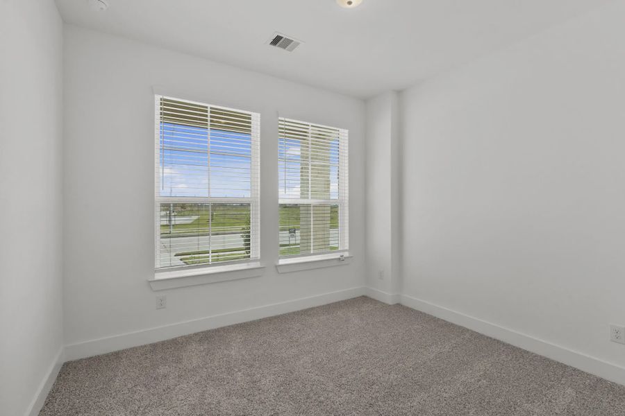 Representative unfurnished interior of a home built from the Carriagehouse by Chesmar Homes in Meridiana Townhomes, Iowa Colony (Image 93).