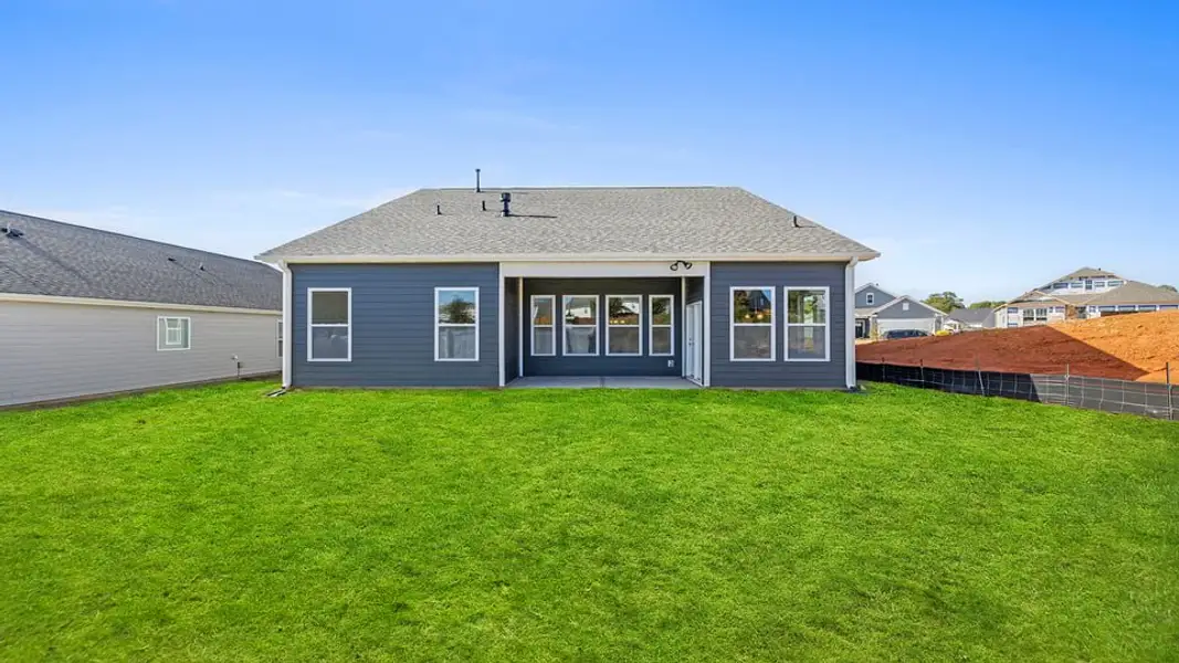 Exterior details and patio area of a home in Whitehawk Meadows, Travelers Rest (Image 3).