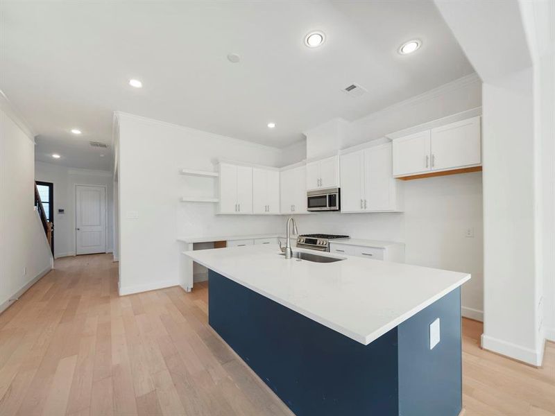 Kitchen (Sample photos of a completed Bordeaux floor plan. The image may feature alternative selections and/or upgrades.)