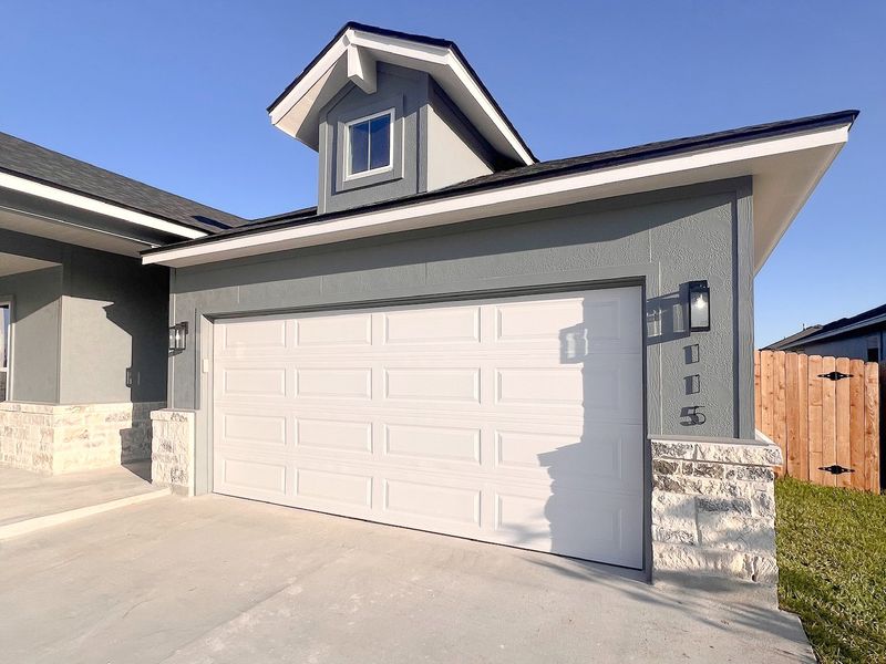 Front exterior of a new home in TerraVista, Victoria, TX, highlighting curb appeal (Image 12).