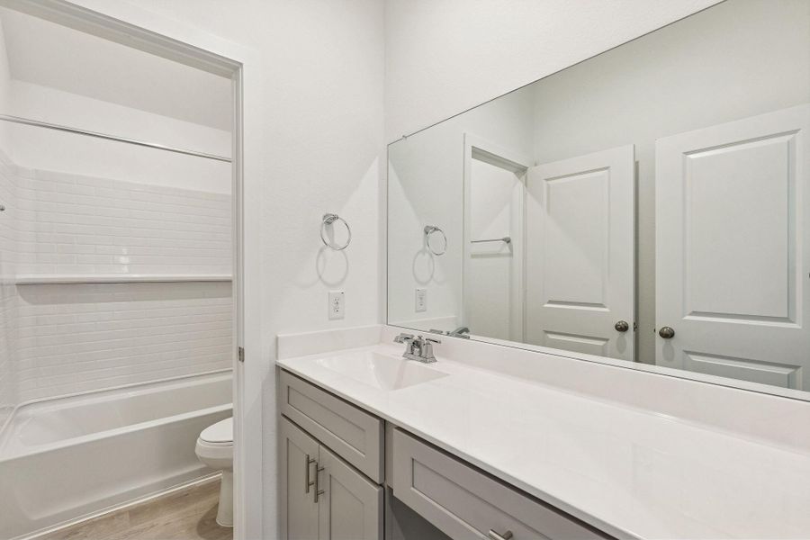 Furnished interior view inside a new home in Ellerden, Tomball (Image 12).