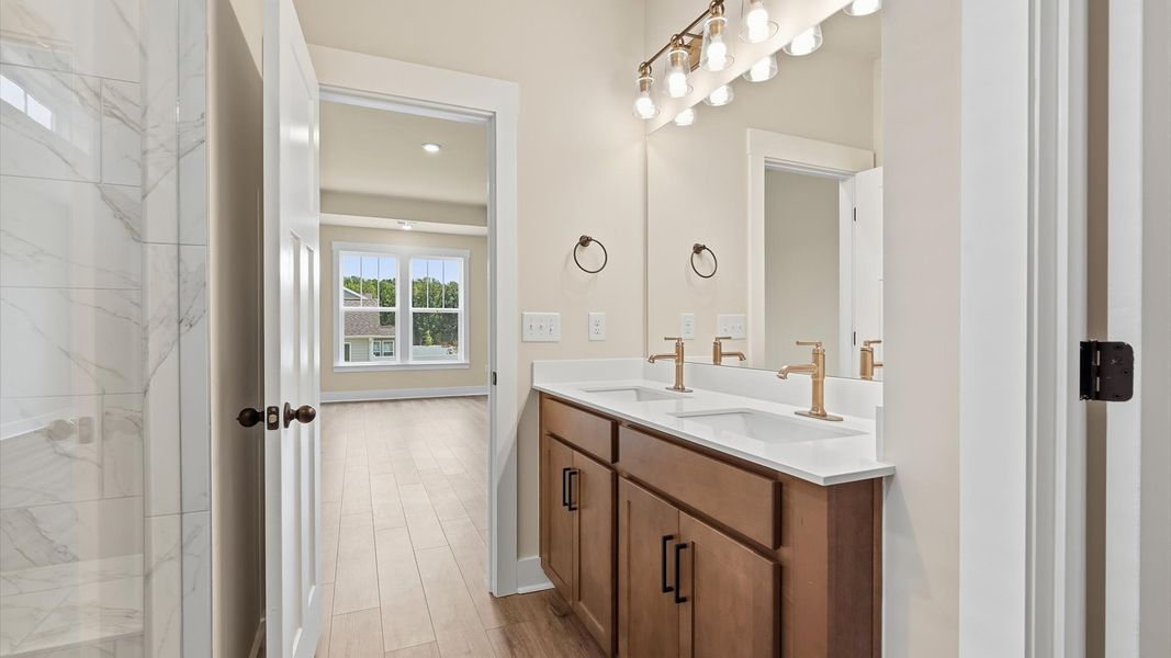Spacious and modern primary bathroom with walk-in shower and first-class double vanity setup in Woodruff, SC Spacious and modern primary bathroom with walk-in shower and first-class double vanity setup in Woodruff, SC