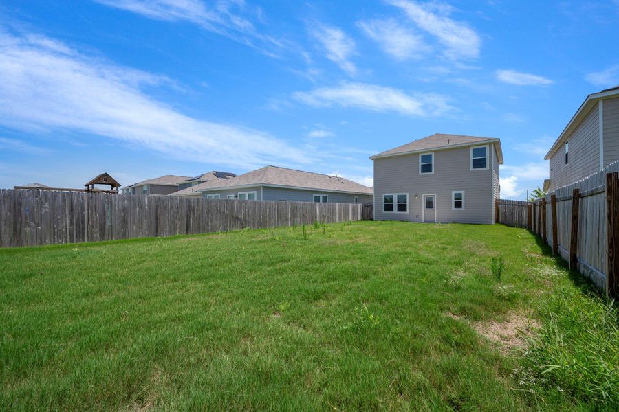 Front exterior of a new home in Cottonwood Farms, Hutto, TX, highlighting curb appeal (Image 2). Front exterior of a new home in Cottonwood Farms, Hutto, TX, highlighting curb appeal (Image 2).