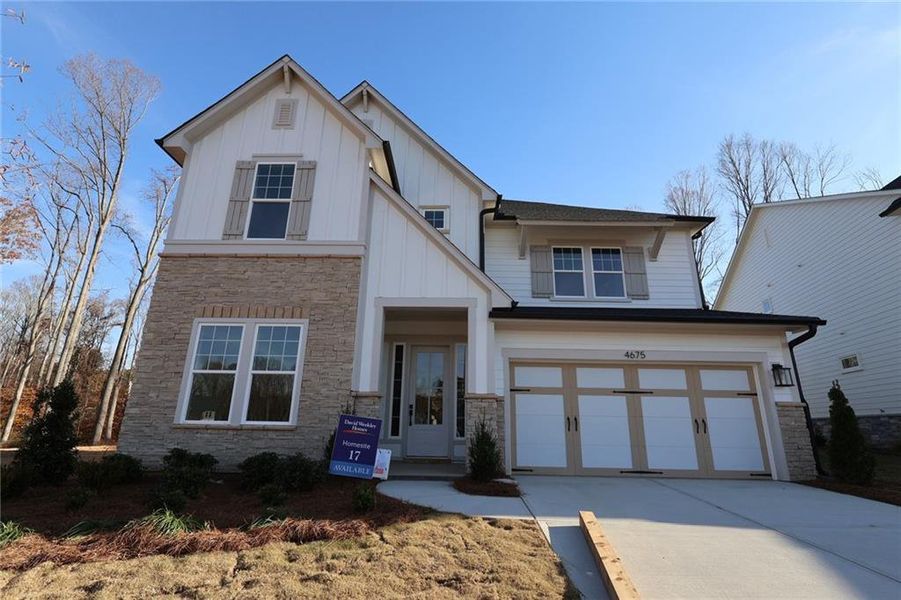 Front exterior of a new home in Settingdown Farms, Cumming, GA, highlighting curb appeal (Image 1).