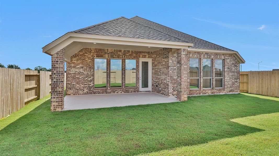 Front exterior of a new home in Grange 50', Katy, TX, highlighting curb appeal (Image 15). Front exterior of a new home in Grange 50', Katy, TX, highlighting curb appeal (Image 15).