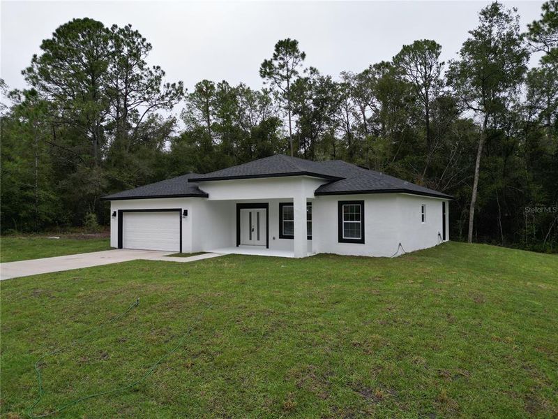 Exterior details and patio area of a home in , Citrus Springs (Image 31).
