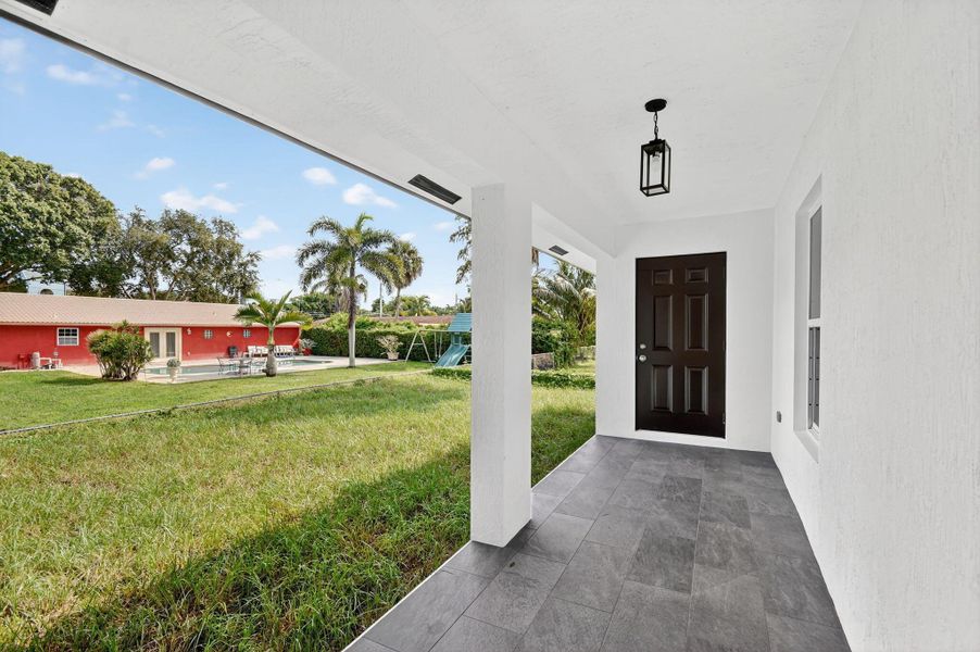 Front exterior of a new home in , West Palm Beach, FL, highlighting curb appeal (Image 13).