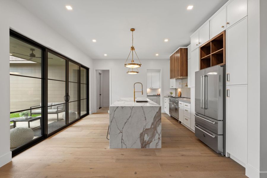 large kitchen space overlooking the backyard