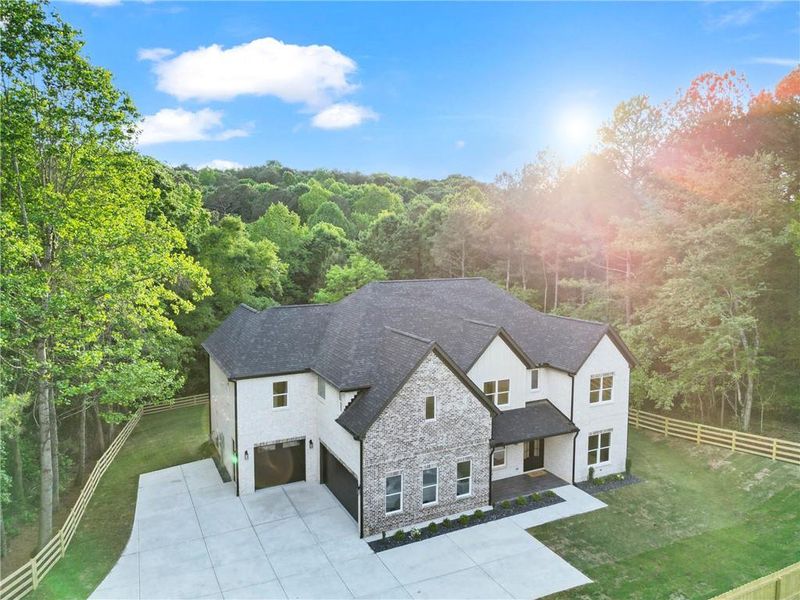 Front exterior of a new home in , Dacula, GA, highlighting curb appeal (Image 26).