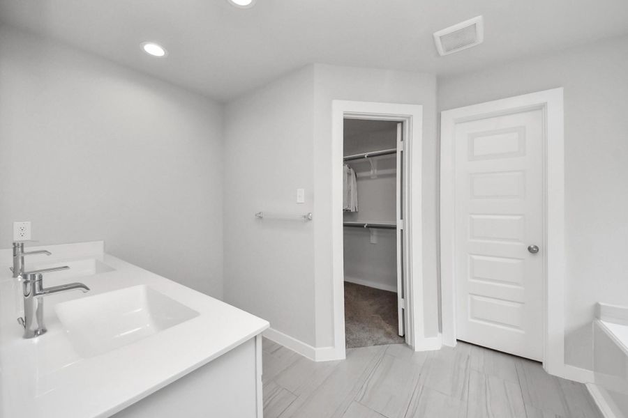 Features a spacious double-sink vanity