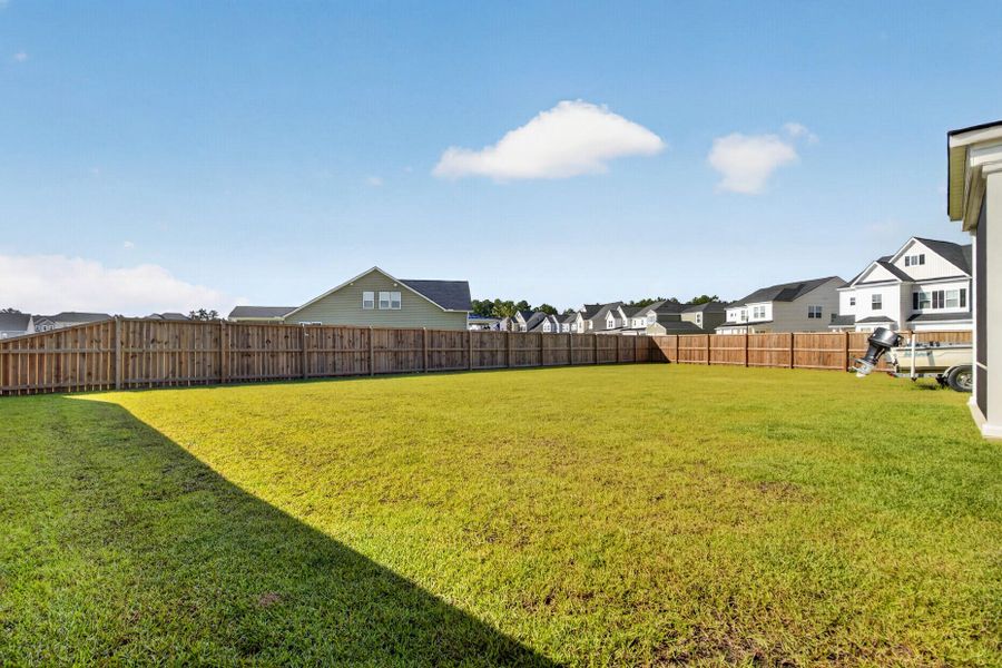 Exterior details and patio area of a home in Lindera Preserve at Cane Bay Plantation, Summerville (Image 21).