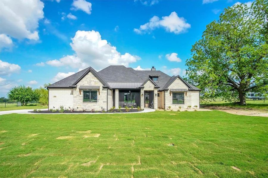 Front exterior of a new home in , Springtown, TX, highlighting curb appeal (Image 26).