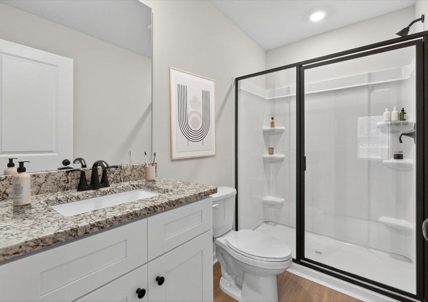 Master bathroom has a glass-enclosed shower