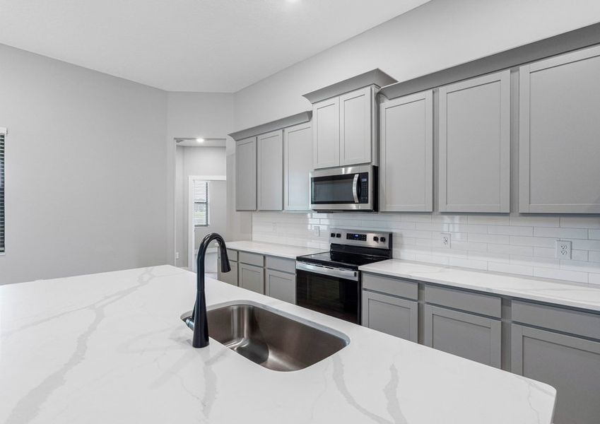 Each kitchen includes stainless-steel appliances