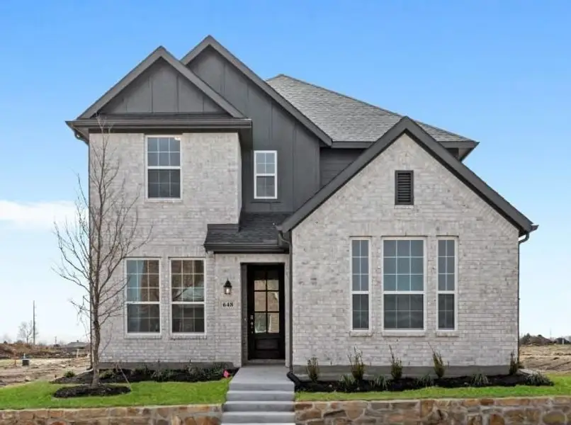 Representative exterior photo of a completed home built from the Willow by UnionMain Homes in Edgewater, Fate, TX (Image 1). Representative exterior photo of a completed home built from the Willow by UnionMain Homes in Edgewater, Fate, TX (Image 1).