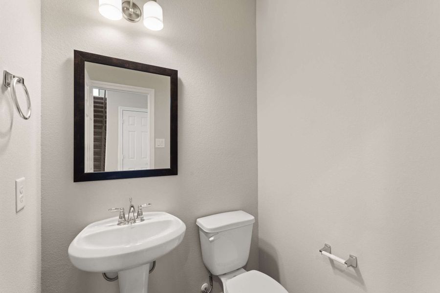 The powder room is conveniently located close to the main living space.