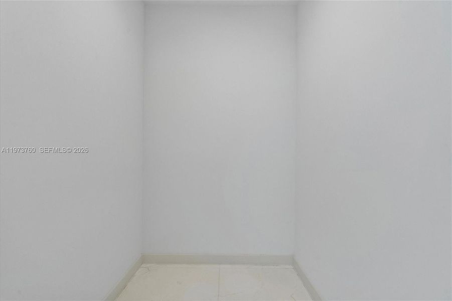 Spacious, unfurnished interior of a new home in Aston Martin Residences, Miami (Image 52).