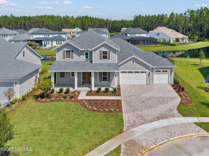 Front exterior of a new home in , St. Johns, FL, highlighting curb appeal (Image 1). Front exterior of a new home in , St. Johns, FL, highlighting curb appeal (Image 1).