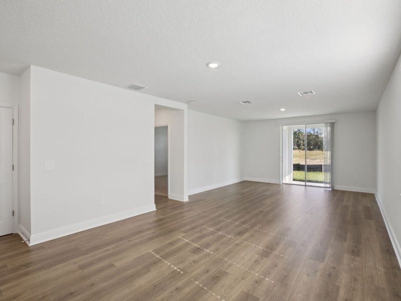 Spacious, unfurnished interior of a new home in The Reserve at Hammock Oaks - Classic Series, Lady Lake (Image 11).