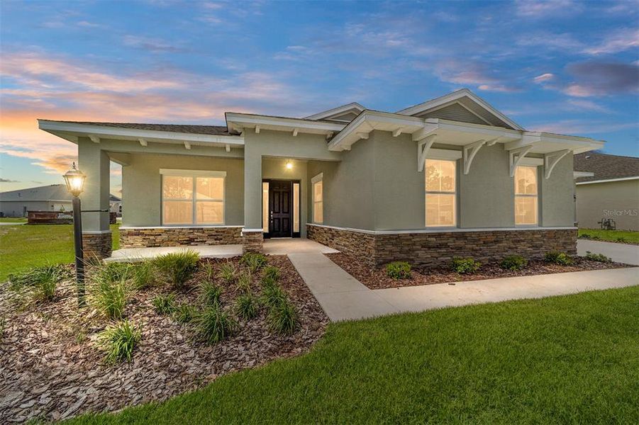 Front exterior of a new home in On Top of the World Communities, Ocala, FL, highlighting curb appeal (Image 22).