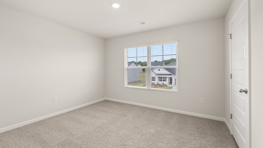 Spacious, unfurnished interior of a new home in Preserve at Dove Creek, Statham (Image 22).