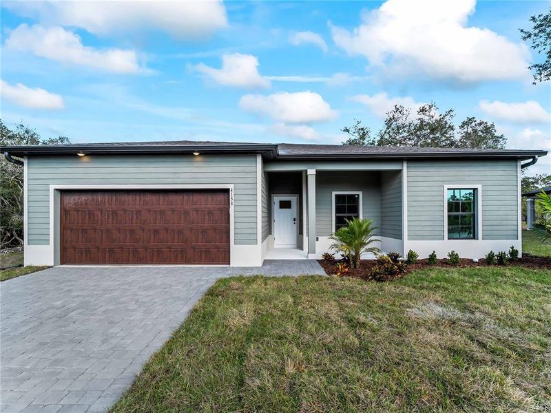 Front exterior of a new home in , North Port, FL, highlighting curb appeal (Image 30).