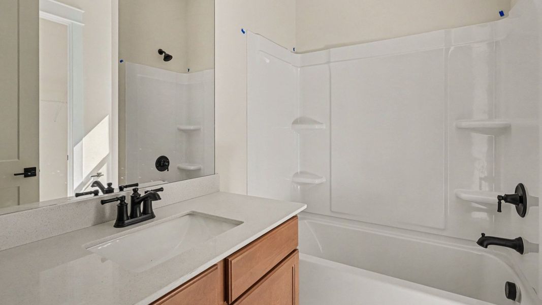 Bathroom with bathtub and dual vanities Bathroom with bathtub and dual vanities