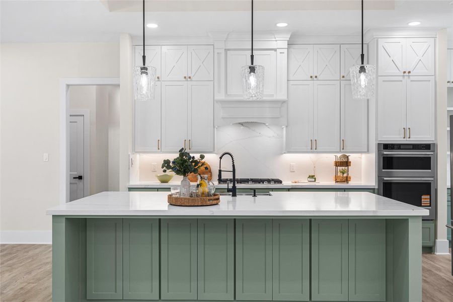 Featuring Stainless Steel appliances, including 5-Burner Gas Cook Top, Microwave and Oven Combo, Dishwasher, and Refrigerator.