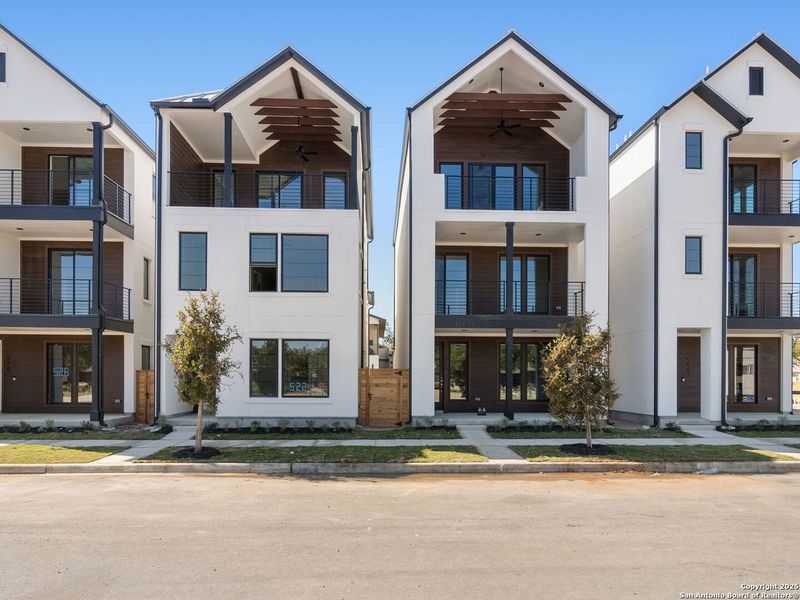 Front exterior of a new home in Victoria Commons, San Antonio, TX, highlighting curb appeal (Image 29).