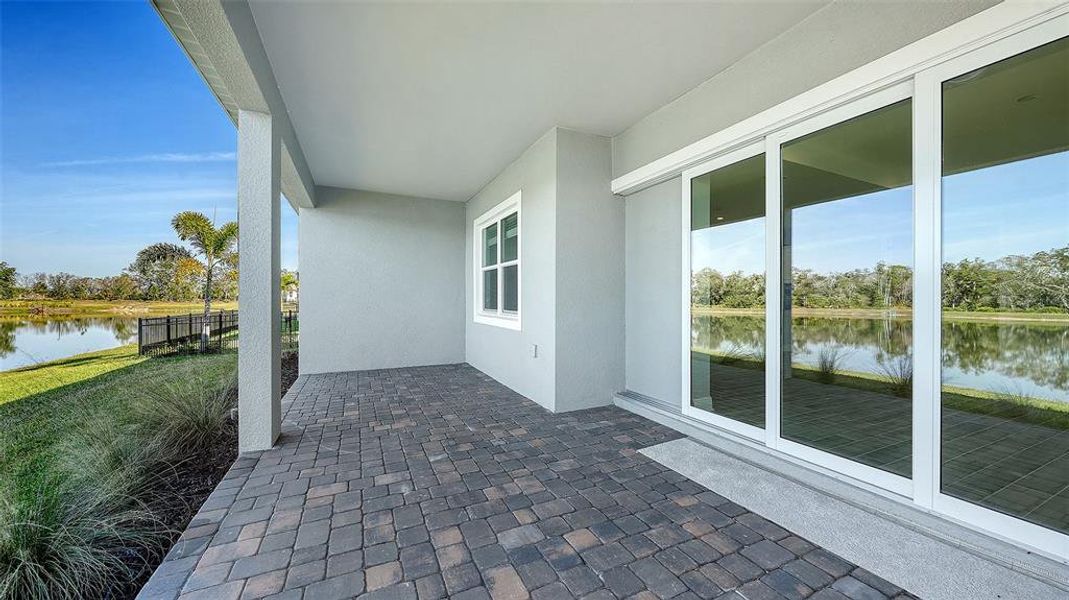 Exterior details and patio area of a home in Wildleaf, Parrish (Image 22).