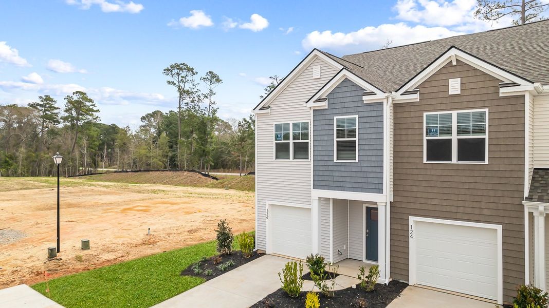 Front exterior of a new home in Marion Village, Santee, SC, highlighting curb appeal (Image 1). Front exterior of a new home in Marion Village, Santee, SC, highlighting curb appeal (Image 1).