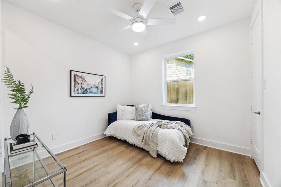 The first floor suite includes its own private full bath. This bedroom has the space to do double duty as an office. The first floor suite includes its own private full bath. This bedroom has the space to do double duty as an office.