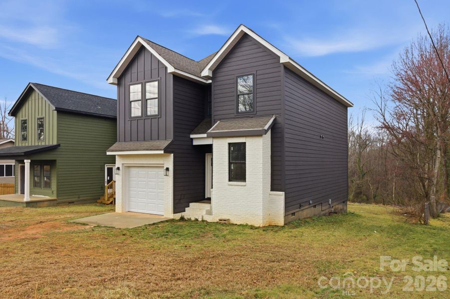 Front exterior of a new home in , Statesville, NC, highlighting curb appeal (Image 15).