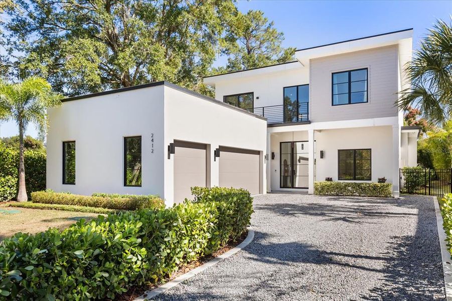 Front exterior of a new home in , Winter Park, FL, highlighting curb appeal (Image 1). Front exterior of a new home in , Winter Park, FL, highlighting curb appeal (Image 1).